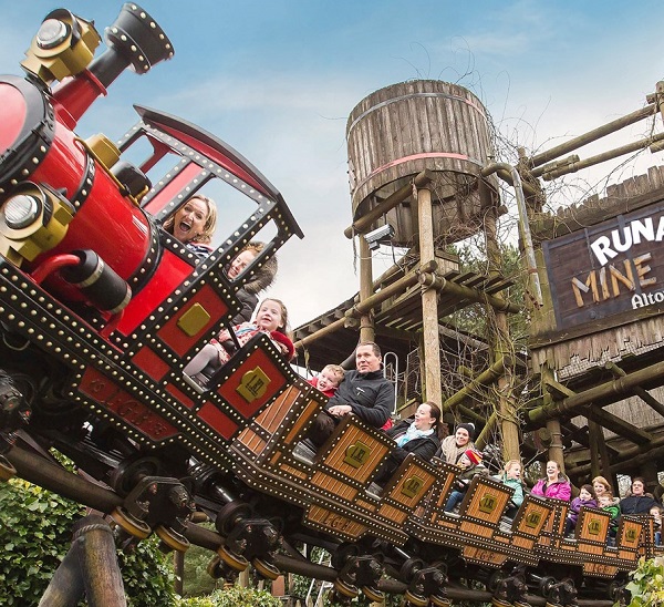 People enjoying runaway mine train ride