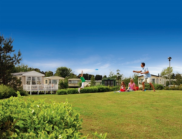Family having a picnic at outside Seton Sands Caravan