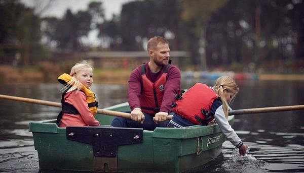 Father and daughters enjoying kayak